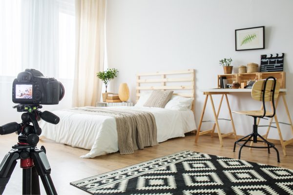 residential classic photography Camera on a tripod in modern bedroom interior